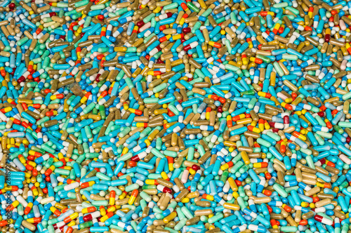 Many colorful medicines expire on cement floor