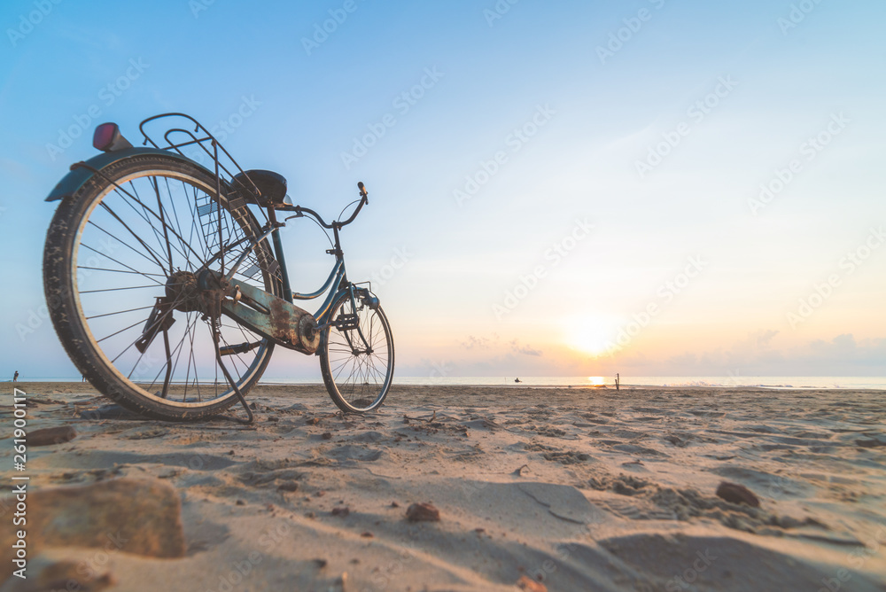 Fototapeta premium Bicycle on the beach at sunset