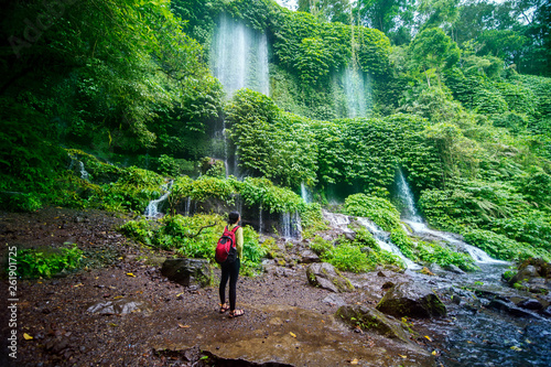 Female hiker enjoys Benang Kelambu waterfall view