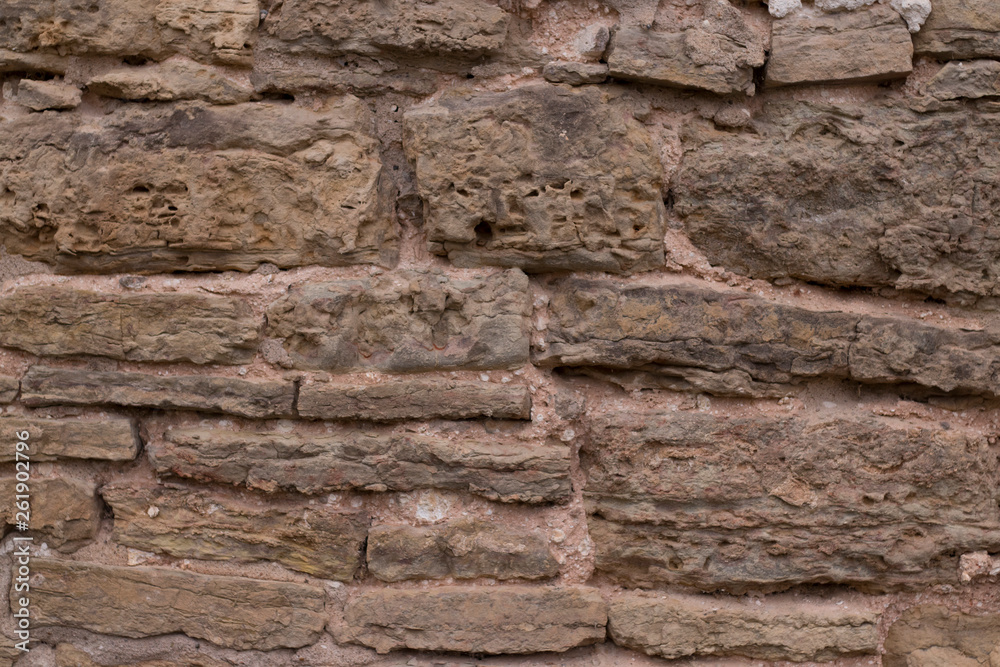 close view of the old stone brick wall of the castle