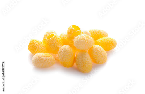 yellow thai silkworm cocoons pile isolated on white background.