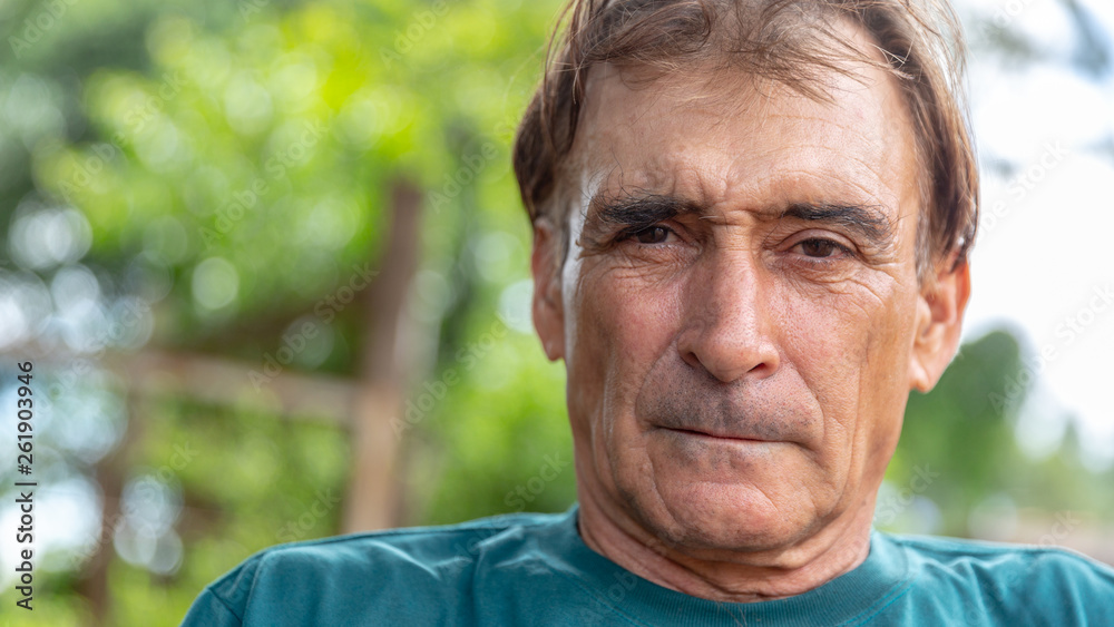 Older man smiling on nature. Older man smiling on nature.