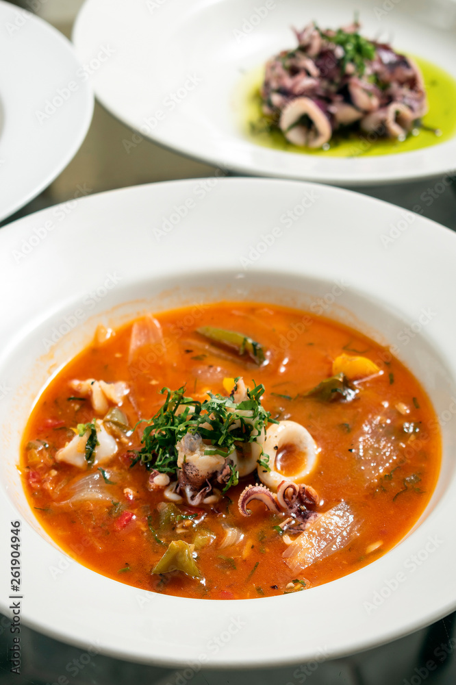 stewed squid seafood soup in spicy tomato and vegetable sauce stewed squid seafood soup in spicy tomato and vegetable sauce