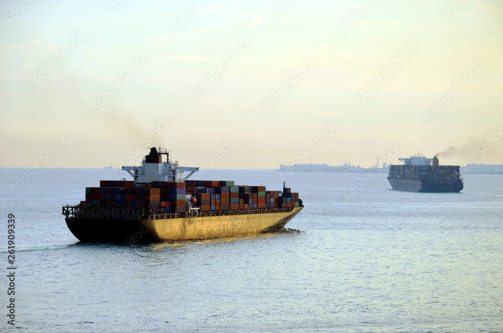 Cargo ships leaving port.
