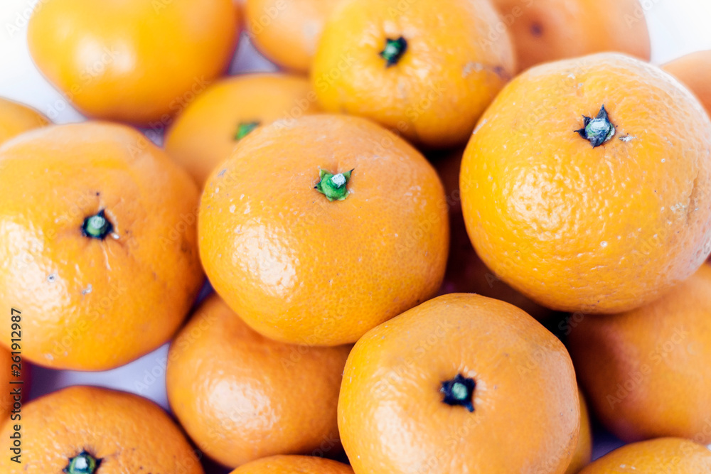 Fresh whole mandarin oranges background , top view. Fresh whole mandarin oranges background , top view.
