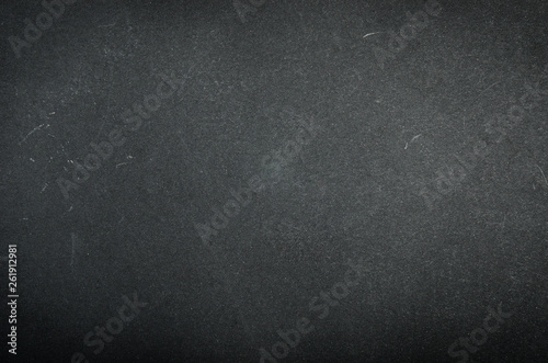 Black paper texture with scuffs and scratches.