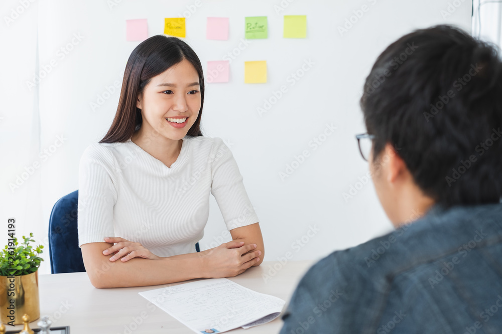 Asian business woman discussing/job interview with colleauge/boss for business meeting Asian business woman discussing/job interview with colleauge/boss for business meeting