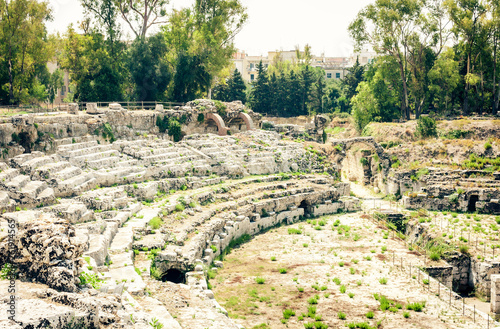 The Roman amphitheater of Syracuse (Siracusa) – ruins in Archeological park, Sicily, Italy.