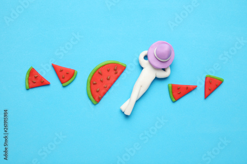 Sweet summer watermelon art. Red and juicy slices on blue background. © Andrii Zastrozhnov