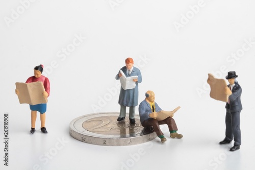 miniature of people reading and euro coins