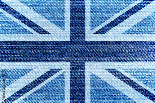 United Kingdom (UK) national flag on jeans texture with blue and white colours over denim background. British flag on denim fabric.