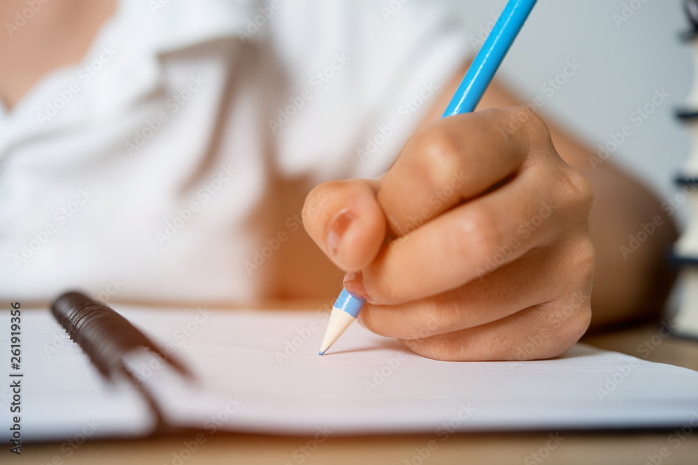 Hand and pencil pictures of students writing Education concept With copy space Hand and pencil pictures of students writing Education concept With copy space