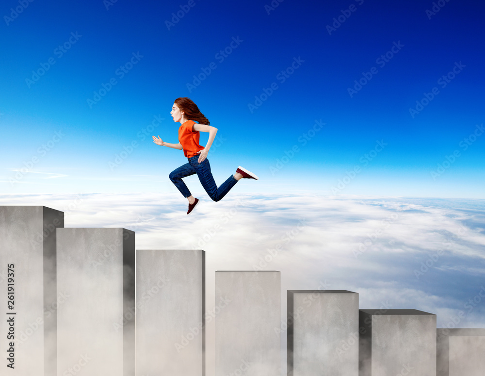 Young woman running up on the stairs blocks. Young woman running up on the stairs blocks.