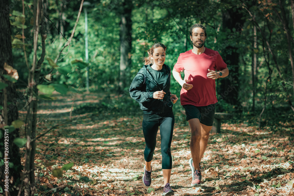 Young Couple Jogging, Nature, Outdoors Young Couple Jogging, Nature, Outdoors