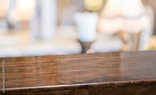 wood table at restaurant blur background.Empty perspective hardwood bar with blur coffee shop with bokeh light,Mock up for display or montage of product,Banner or header for advertise on online media