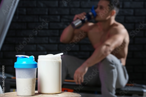 Protein shake on table against dark background photo