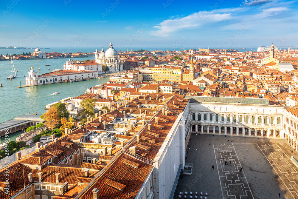 Aerial view of Venice, Santa Maria della Salute and Piazza San Marco during early morning summer day. World famous Venice landmarks. View from St Mark Campanile.