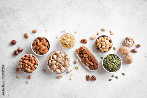 Various Nuts in bowls photo