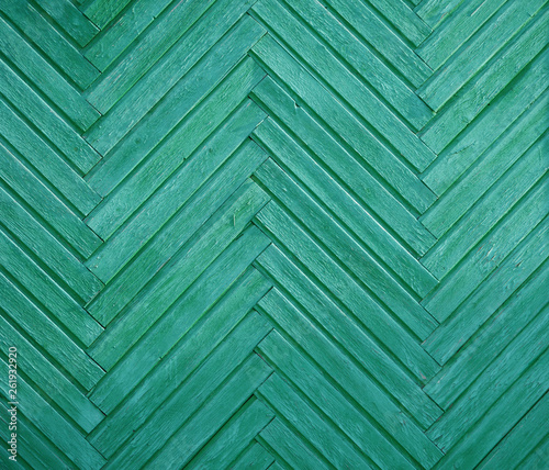 painted boards on the diagonal. color turquoise. old and worn. place for lettering