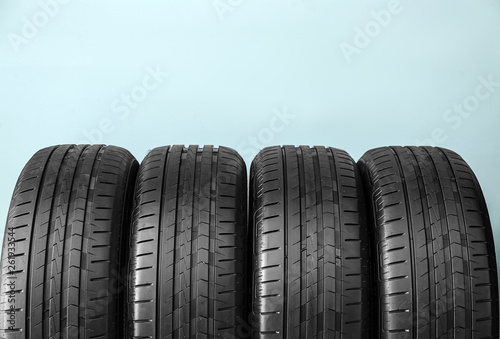 Car tires on color background © Pixel-Shot