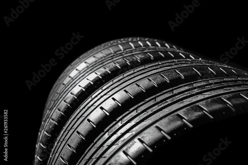 Car tires on dark background, closeup