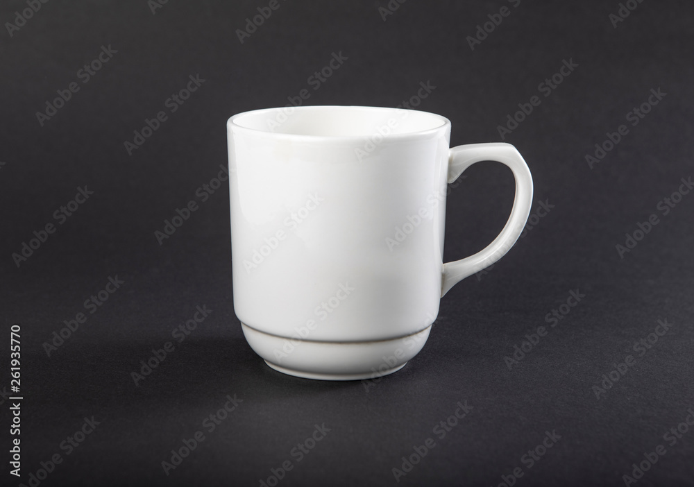 Fototapeta premium Empty white mug on a gray background.