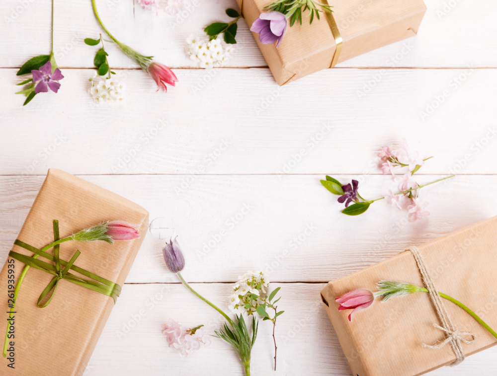 Festive flower composition on the white wooden background. Overhead view Festive flower composition on the white wooden background. Overhead view