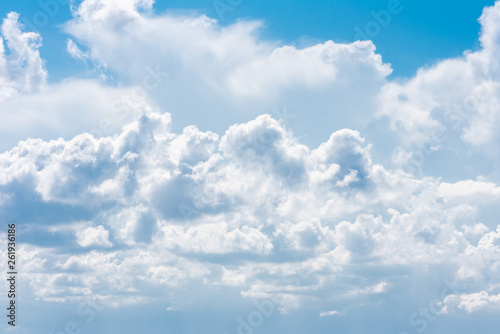 Beautiful white cumulonimbus clouds against the background of the bright blue sky