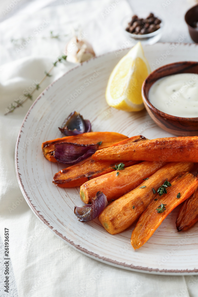 Tasty cooked carrot and sauce on plate Tasty cooked carrot and sauce on plate