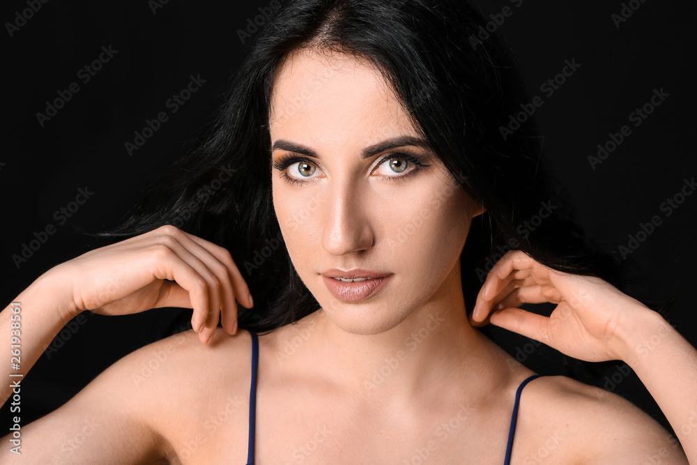 Portrait of beautiful woman on dark background Portrait of beautiful woman on dark background