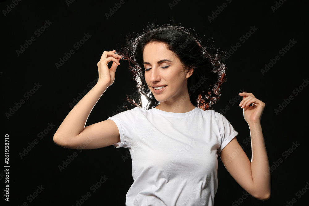 Portrait of beautiful woman on dark background Portrait of beautiful woman on dark background