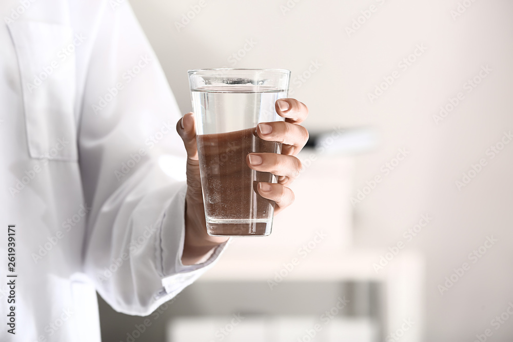 Doctor with glass of water, closeup Doctor with glass of water, closeup