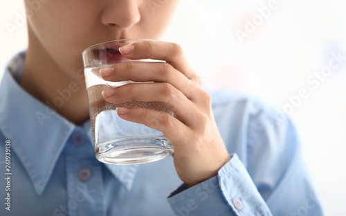 Woman drinking water, closeup