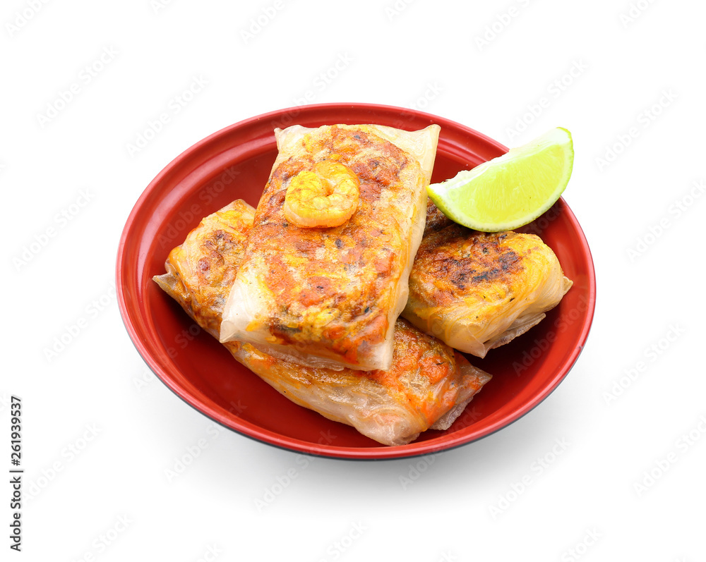Tasty fried spring rolls on white background