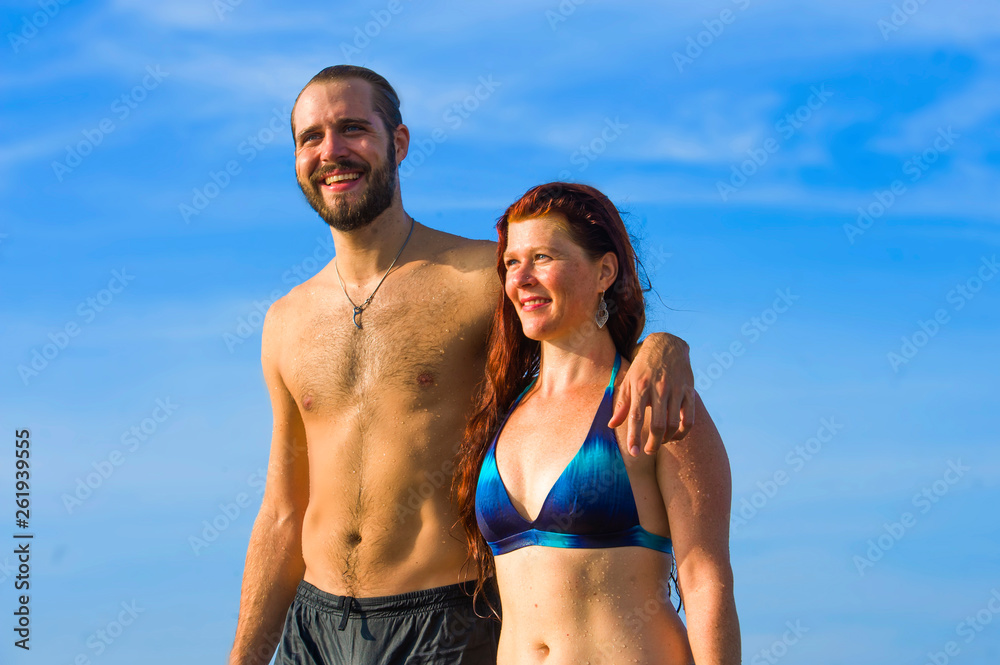 happy and beautiful couple enjoying Summer holidays travel or honeymoon trip together in tropical paradise beach having fun relaxed and playful on the sea happy and beautiful couple enjoying Summer holidays travel or honeymoon trip together in tropical paradise beach having fun relaxed and playful on the sea