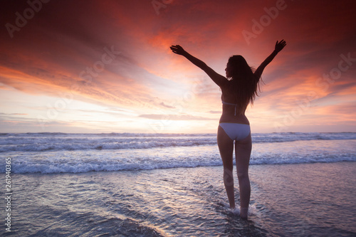 Woman at sea sunset