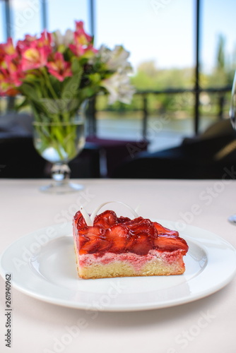 Spring cake with strawberry jam and fresh strawberries