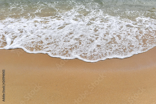 Fototapeta Naklejka Na Ścianę i Meble -  Soft motion waves on the sandy beach