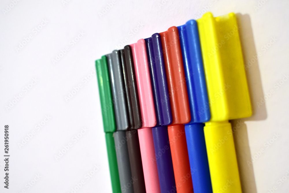 Coloured marker pencils attached together Coloured marker pencils attached together