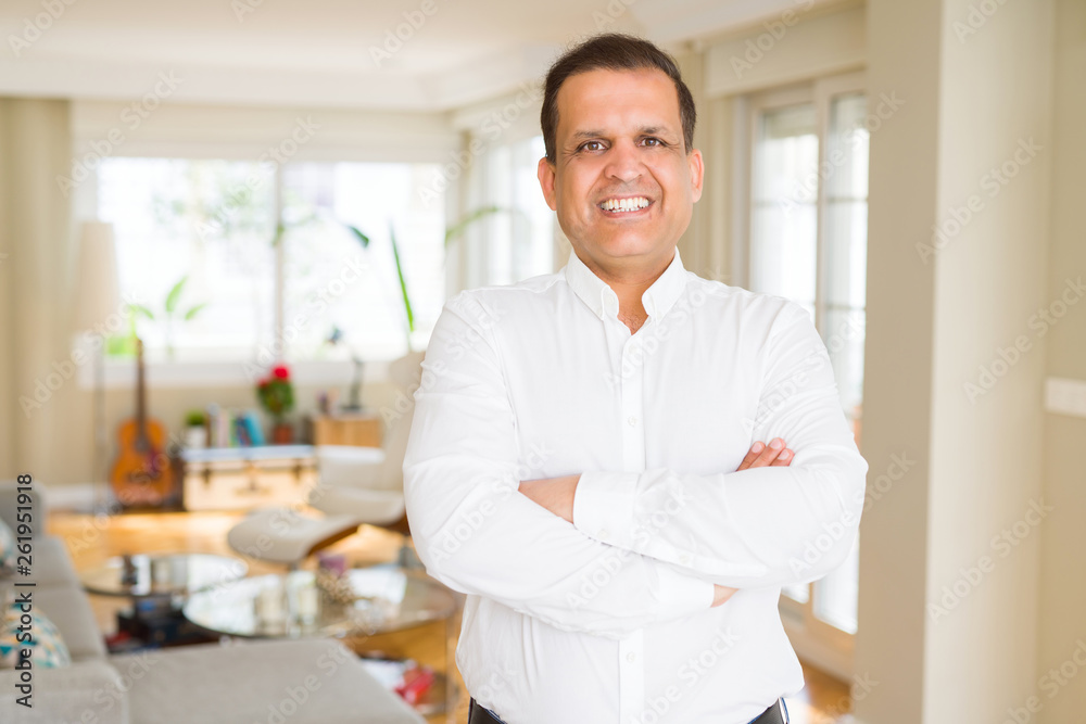 Middle age man smiling confident to the camera at home Middle age man smiling confident to the camera at home
