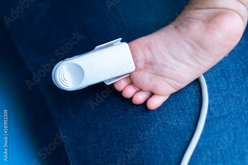 Fingertip Pulse Oximeter on toe of little baby child photo