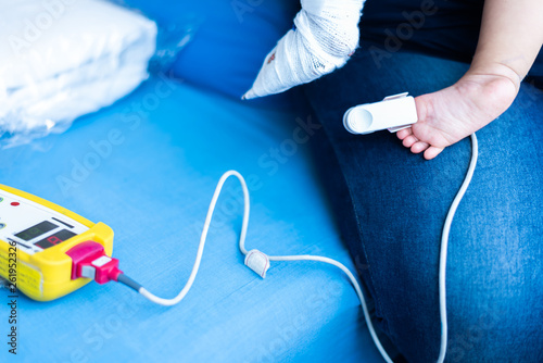 Fingertip Pulse Oximeter on toe of little baby child photo