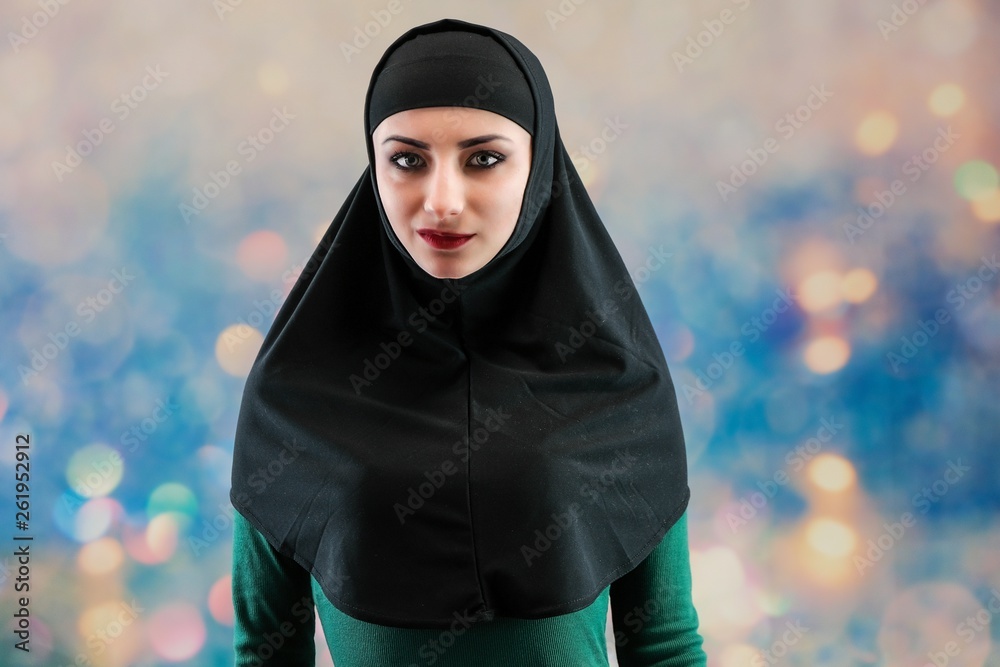 Concept Beauty sexy fashion model woman in hijab portrait, with long  beautiful hair on multicolored background standing. Beautiful young  brunette girl posing in studio. Stock-Foto | Adobe Stock