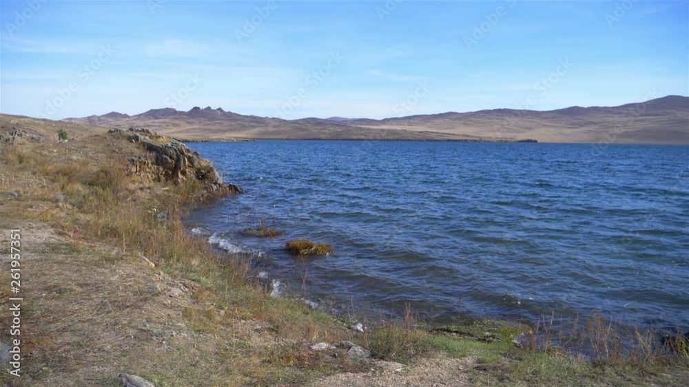 Beautiful landscape view with blue sky of Baikal lake in Olkhon island slow motion wave, Irkutsk Russia Beautiful landscape view with blue sky of Baikal lake in Olkhon island slow motion wave, Irkutsk Russia