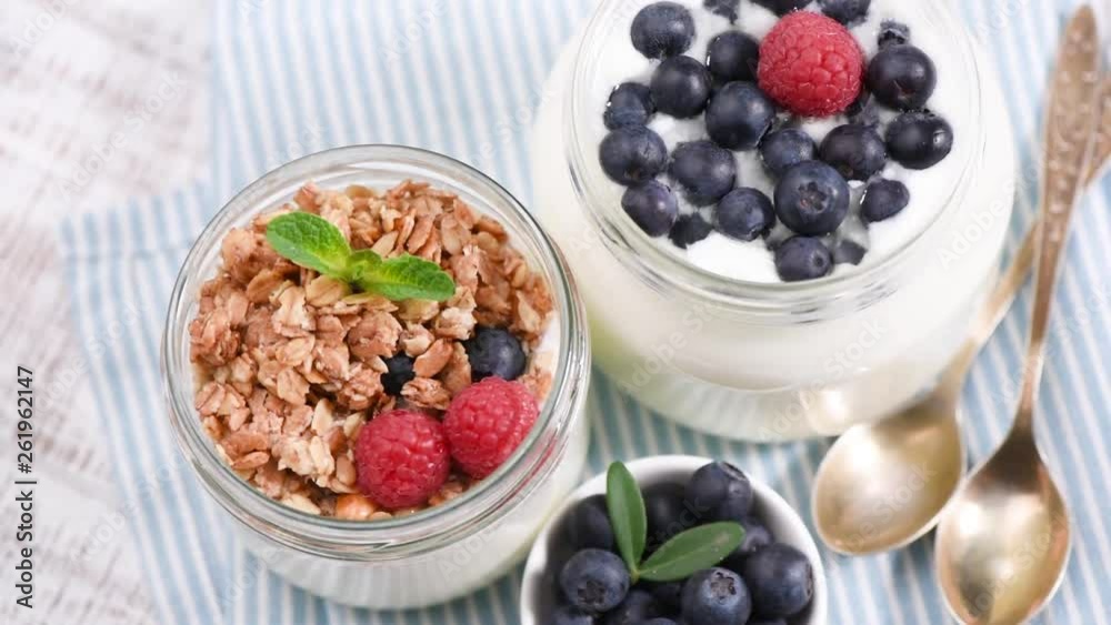 Healthy Food. Yogurt, Granola, Berries in Jar. Top View Rotation footage Healthy Food. Yogurt, Granola, Berries in Jar. Top View Rotation footage