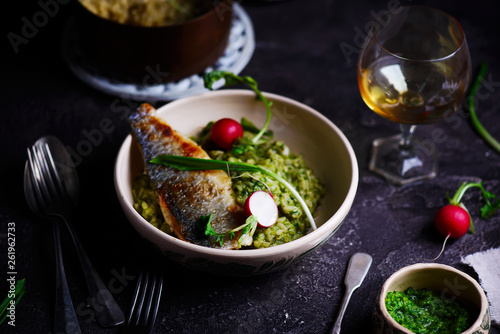 risotto with wild garlic and sea bass.style rustic.