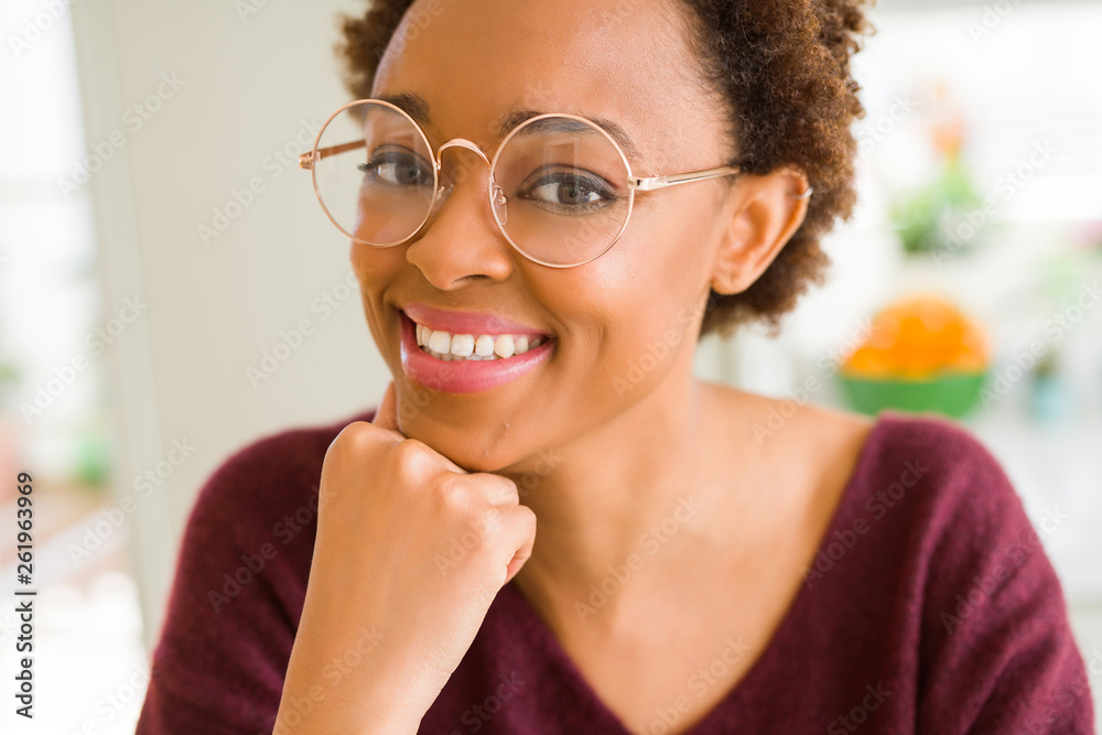 Beautiful young african woman with afro hair wearing glasses Beautiful young african woman with afro hair wearing glasses