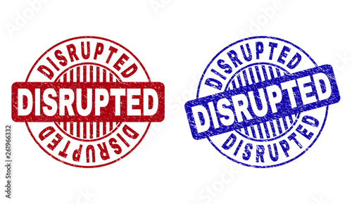 Grunge DISRUPTED round stamp seals isolated on a white background. Round seals with grunge texture in red and blue colors. Vector rubber watermark of DISRUPTED caption inside circle form with stripes.