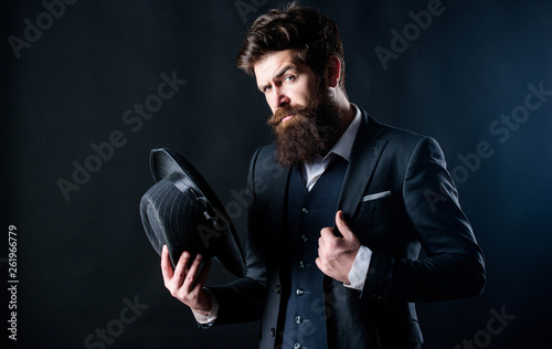 Elegant and stylish hipster. Retro fashion hat. Man with hat. Vintage fashion. Man well groomed bearded gentleman on dark background. Male fashion and menswear. Formal suit classic style outfit