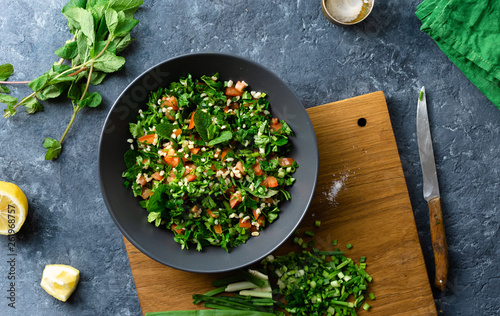 Raw ingredients cooking salad tabouli Healthy food photo